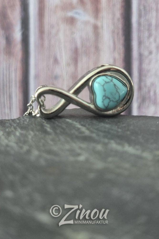 Tierhaarschmuck Infinity-Anhänger mit türkisem Herz auf Schieferstein, seitliche Ansicht – Gedenkschmuck von Zinou Minimanufaktu